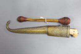A near Eastern dagger with associated scabbard and a priest or drum stick