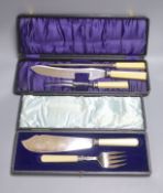 A cased pair of plated fish servers and a cased three piece carving set.
