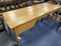 A 19th century French walnut farmhouse table, fitted with one deep and one shallow frieze drawer,