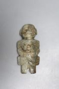 A Meso American jadeite group of a parent carrying a child, possibly Maya Culture, 200-