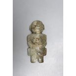 A Meso American jadeite group of a parent carrying a child, possibly Maya Culture, 200-