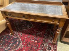 A Victorian mahogany two drawer writing table, with a leather inset top, width 114cm, depth 52cm,