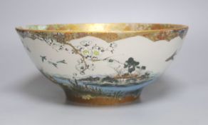A large early 20th century Japanese Kutani bowl, painted with peacocks and flowers, 13cm high,