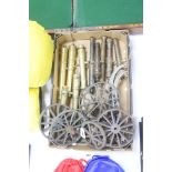 A quantity of cast bronze and brass model cannons, assorted carriage wheels and parts, 20th century,