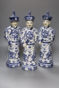 A trio of large Chinese blue and white figures, impressed seal marks to undersides, height 45cm