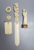 A 19th century carved ivory Madonna child, an ivory figural carving, a pendant, a brooch, a page