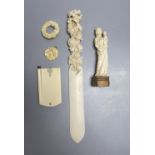 A 19th century carved ivory Madonna child, an ivory figural carving, a pendant, a brooch, a page