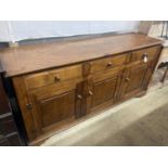 An 18th century style oak low dresser, width 170cm, depth 48cm, height 84cm