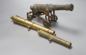 A bronze model cannon engraved ' W. North 1848', 25.5cm, a bronze cannon on an associated
