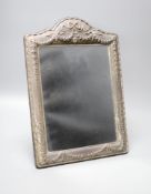 A modern repousse silver mounted easel mirror, Carr's of Sheffield, Sheffield, 1996, 36.1cm.