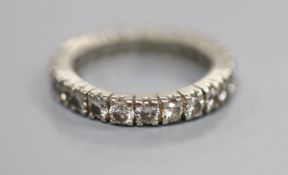 A 750 white metal and diamond set full eternity ring, set with twenty four round brilliant cut