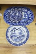 A late 19th century blue and white pottery meat dish, width 50cm, two plates and a Chinese style