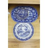 A late 19th century blue and white pottery meat dish, width 50cm, two plates and a Chinese style