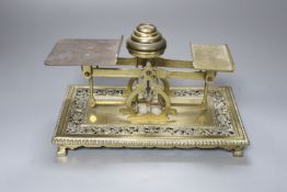 A set of Edwardian brass letter scales, width 22cm height 15cm