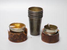 A cased set of six Polish 800 standard white metal silver drinking beakers, 7cm and two other plated