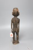 A Papua New Guinea wood figure, painted in coloured pigments, height 34cm