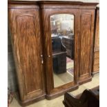 A large Victorian mahogany break front compactum three door wardrobe, length 230cm, depth 60cm,