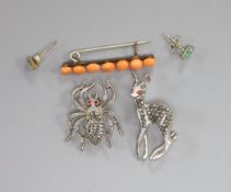 Two marcasite set brooches, a pair of earrings and a coral set brooch.