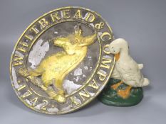 A vintage Whitbread & Company oval plaque, length 33cm, and a painted 'goose' door stop