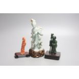 A Chinese coral figure of a lady, 9cm, a Chinese jadeite group of Guanyin with stand 19.5cm and a