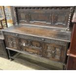 A 1920's Jacobean style oak sideboard, length 152cm, depth 56cm, height 144cm