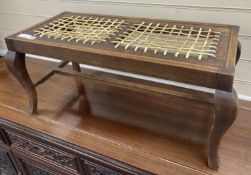 An early 20th century mahogany framed luggage stool with woven strapwork top, 35cm high, width 76cm,