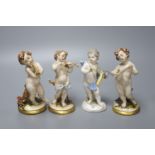 A Meissen porcelain figure of a cherub together with three Continental porcelain cherubs, height