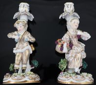 A pair of Victorian John Bevington bone china candlesticks, with child flower picker stems, pseudo