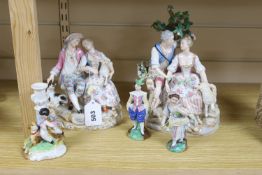A pair of Meissen style porcelain groups and three other figures, tallest 26cm