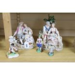 A pair of Meissen style porcelain groups and three other figures, tallest 26cm