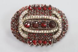 A garnet and seed set oval brooch 37mm (adapted).