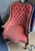A Victorian walnut framed buttoned spoon back upholstered armchair, width 65cm, height 91cm