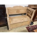 A 19th century East European pine box seat settle, length 110cm, depth 50cm, height 98cm