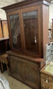 A Victorian mahogany bookcase cupboard, length 126cm, depth 51cm, height 228cm