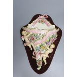 A Victorian cherub and floral porcelain wall pocket, overall 36cm