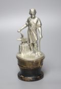 A large cast metal Vulcan car mascot, in the form of a blacksmith, on brass base and lacquered