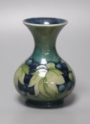 A Moorcroft green and blue leaf and berry vase, height 13cm