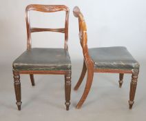 A set of four William IV mahogany buckle back dining chairs, with anthemion carved and fluted