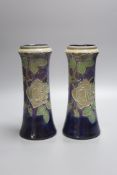 A pair of Doulton stoneware vases, height 26.5cm