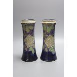 A pair of Doulton stoneware vases, height 26.5cm