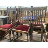 A set of six 1920's oak Carolean style dining chairs (two with arms) and an oak draw leaf dining