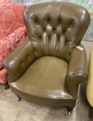 A Victorian library chair upholstered in olive green leather, width 80cm, depth 70cm, height 86cm