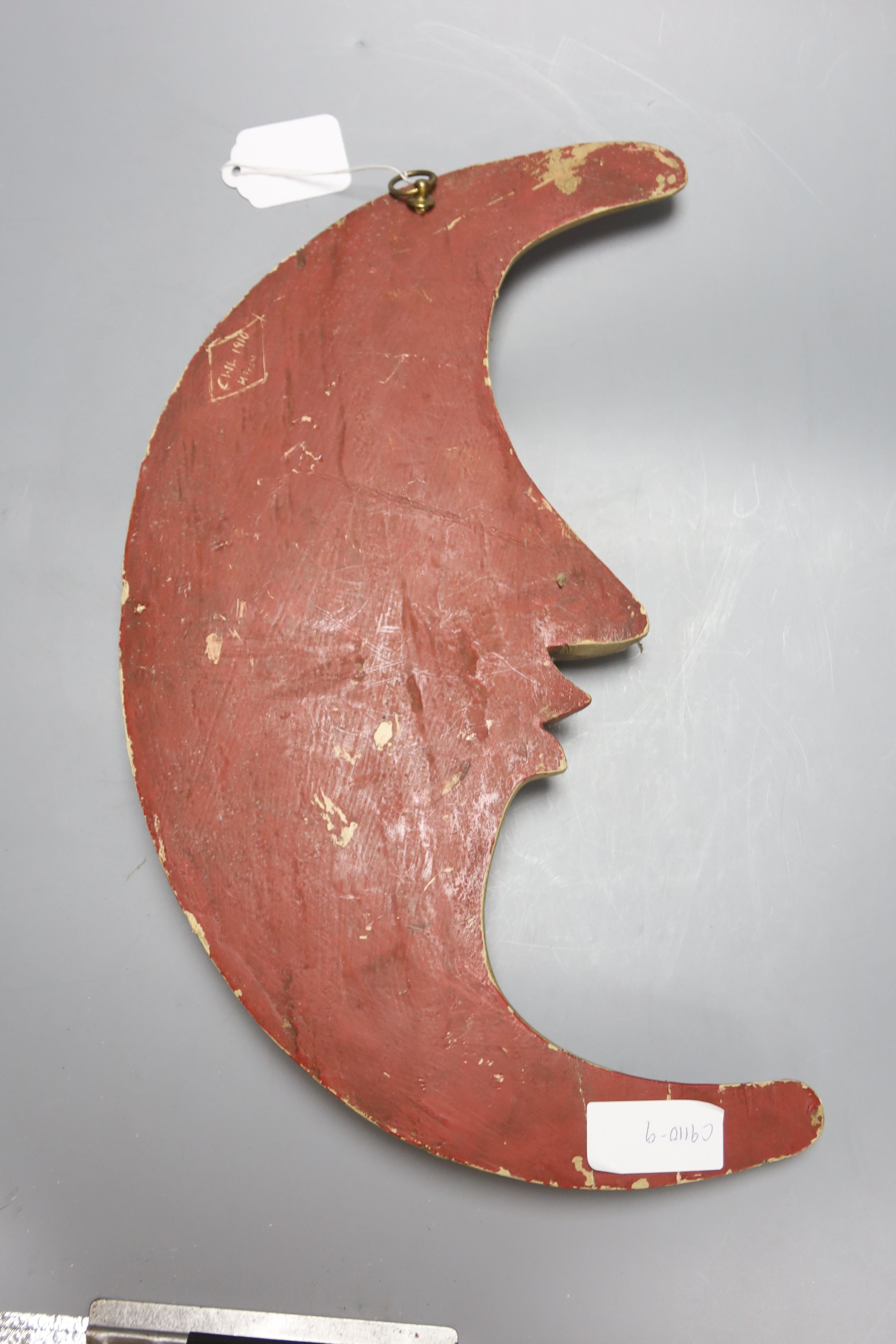 A Continental printed wood crescent 'Man in the Moon' plaque, back inscribed CWL 1910 MAYEN - Image 2 of 3