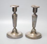 A pair of Austrian or Polish white metal candlesticks, height 20.8cm, gross 19.5oz.