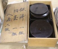 A pair of mid 20th century Japanese black lacquer food boxes and stands