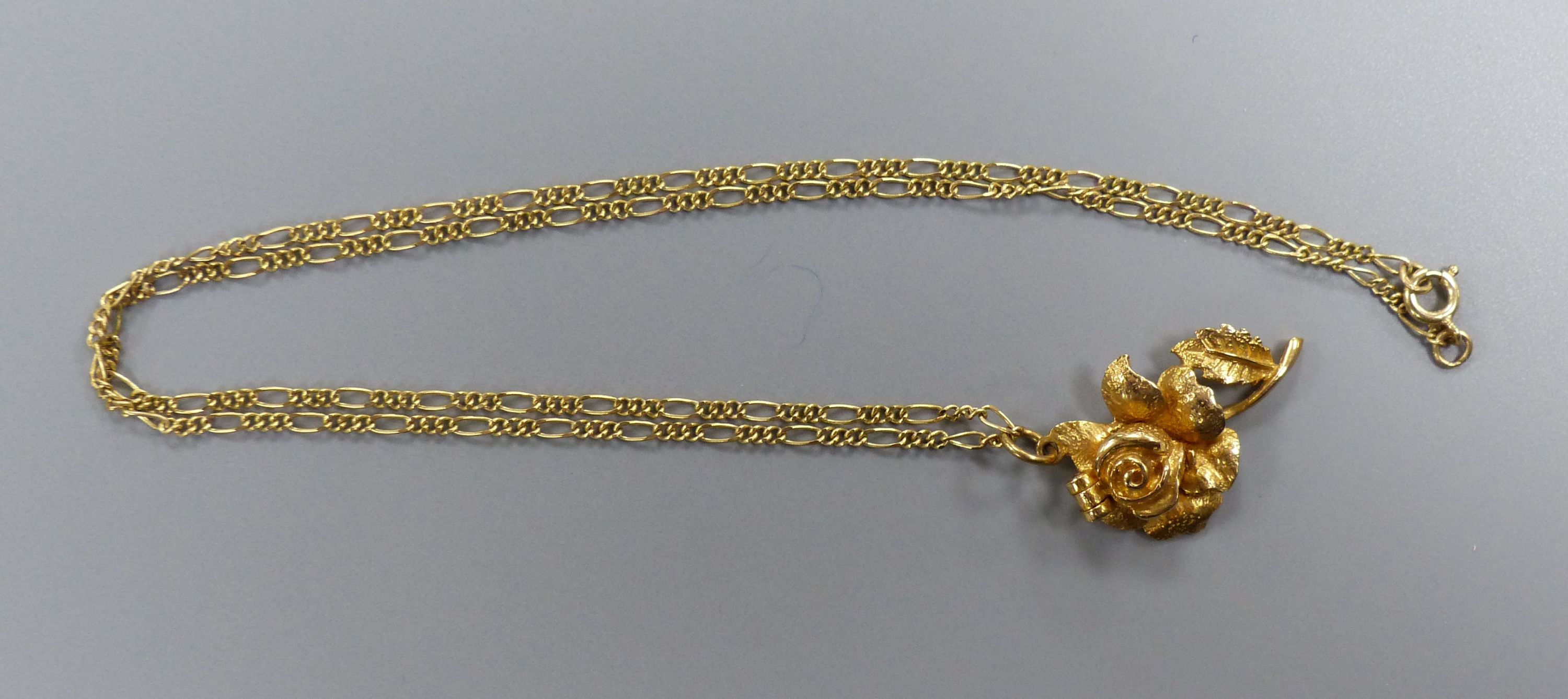 A modern 9ct gold rose pendant, 30mm, on a 9ct gold chain, 43cm, gross 7.5 grams. - Image 2 of 3