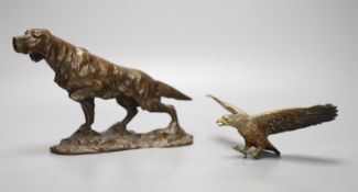 A bronze model of a setter, length 24cm, and a small cold-painted bronze figure of an eagle, wings