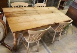 A pine 'farmhouse' kitchen table, length 183cm, depth 87cm, height 78cm fitted single end drawer and