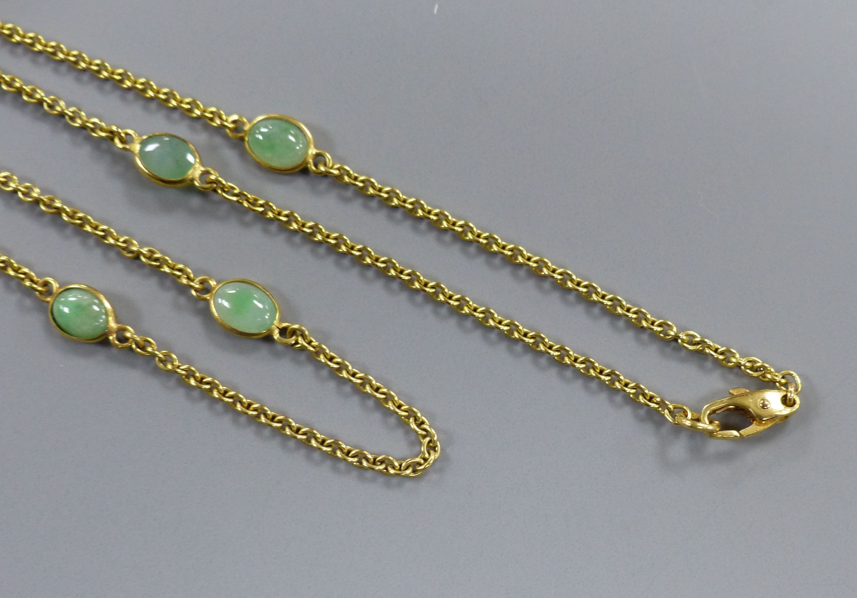 A modern 9ct gold and eight stone cabochon jade set 'spectacle' necklace, 60cm, gross 9.1 grams. - Image 3 of 3