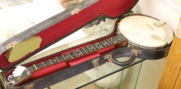 A Windsor popular 4 string banjo, cased